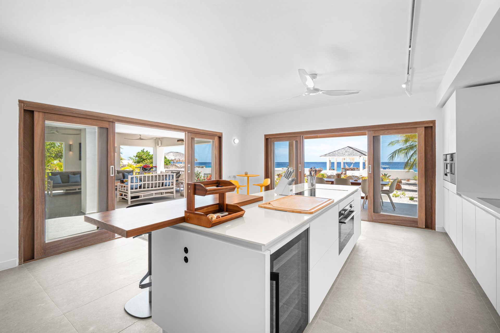 Open chef's kitchen flowing to the ocean terrace