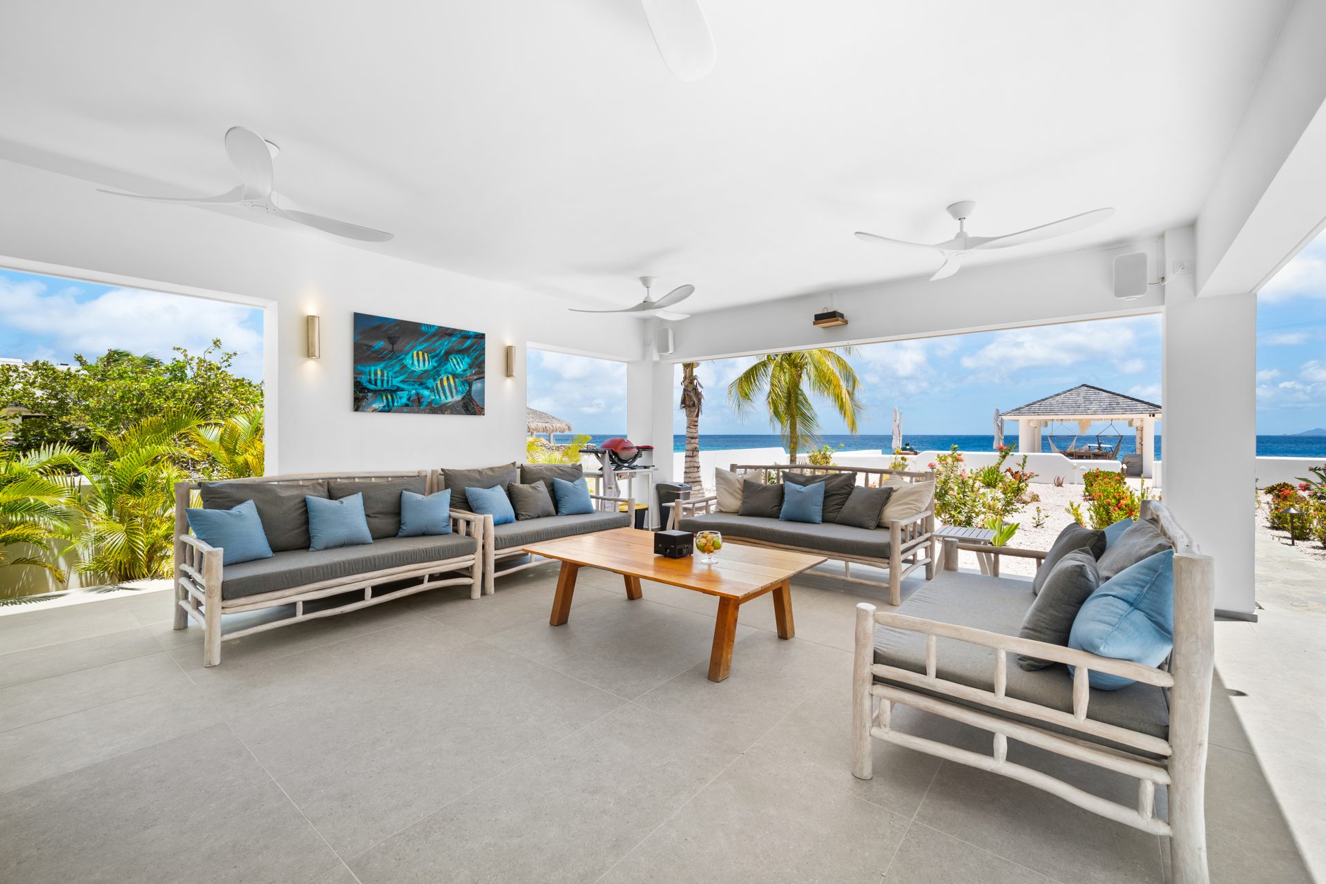 Covered outdoor living room facing the sea