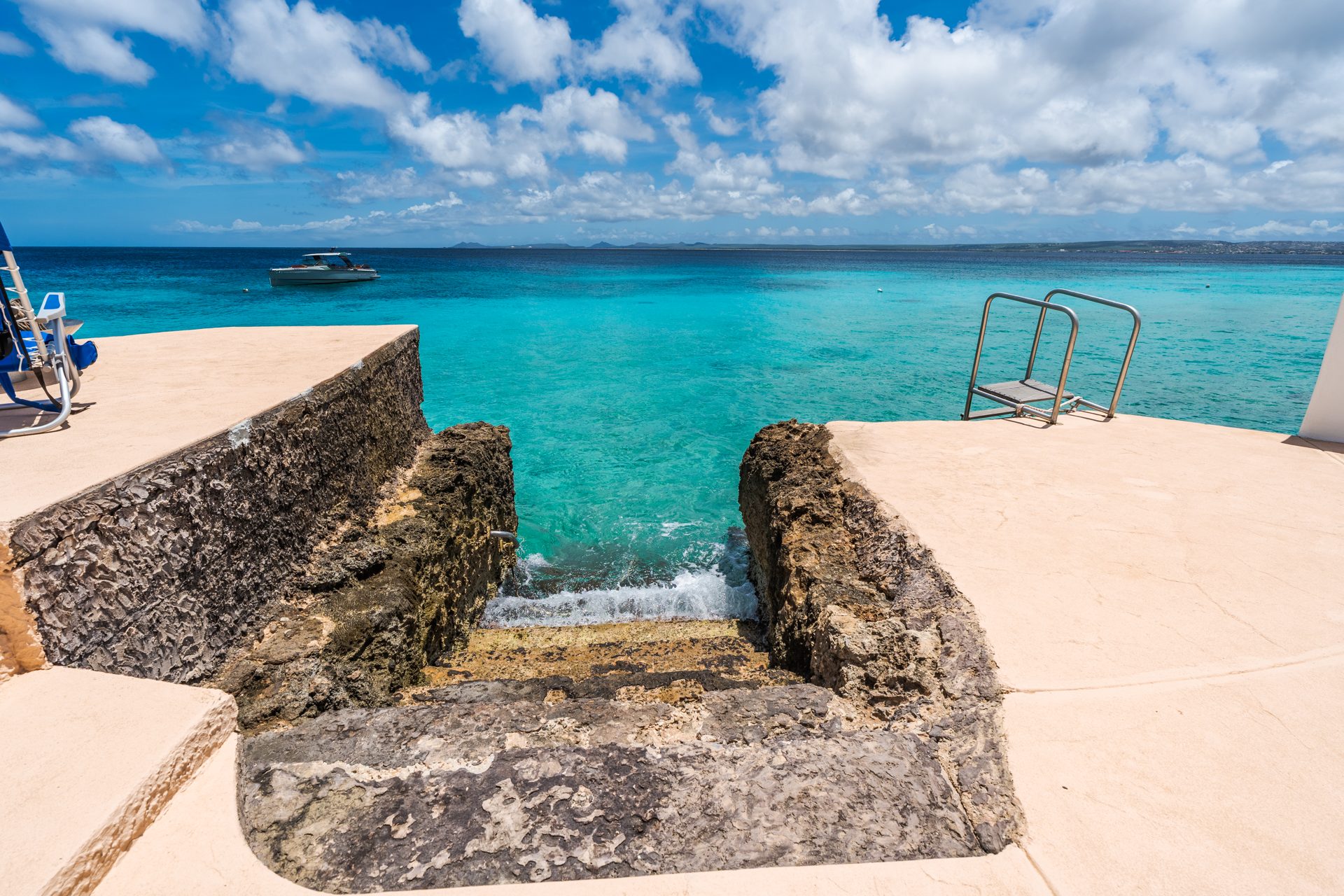 Private ocean entry steps into turquoise water
